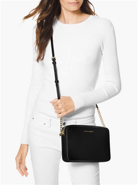 michael kors crossbody black and gold|michael kors side body bag.